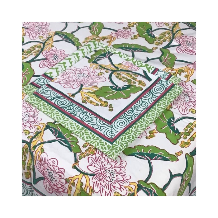 Climbing Lotus Pink 60x120 inch tablecloth, handblock printed with a floral design, covering a long table
