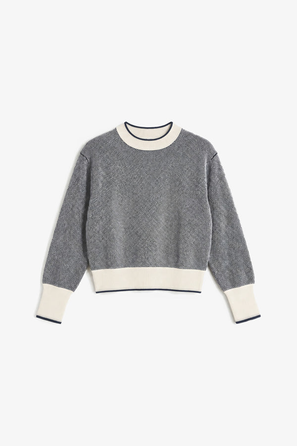 A gray knit crewneck sweater with contrasting cream ribbed trim at the collar, hem, and cuffs, displayed flat against a light gray background. | Still | Exclude