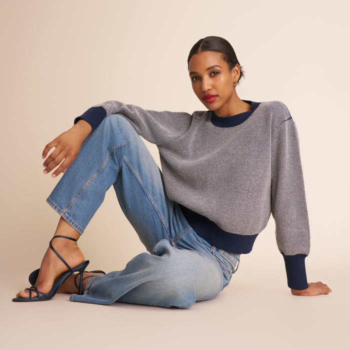 Women in birdeyes sweater and jeans. | Exclude