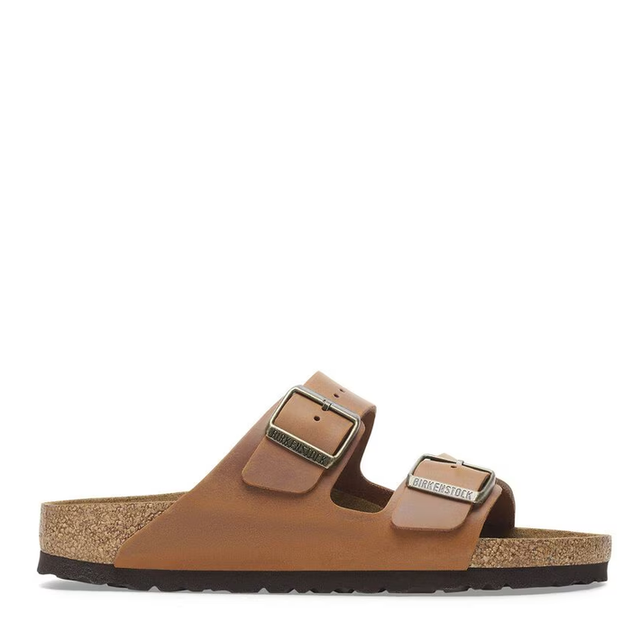A pair of women's brown Birkenstock Arizona sandals with adjustable straps and a buckle, set against a white background.