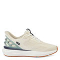 A beige and green men's athletic shoe with a unique cage-like structure on the heel and a mesh upper.