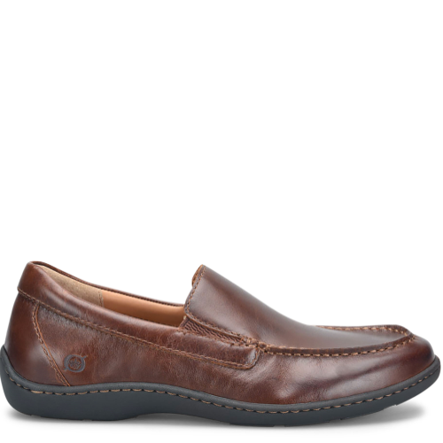 A brown men's dress shoe with a soft hand-finished leather upper and a removable soft fabric suede covered footbed.