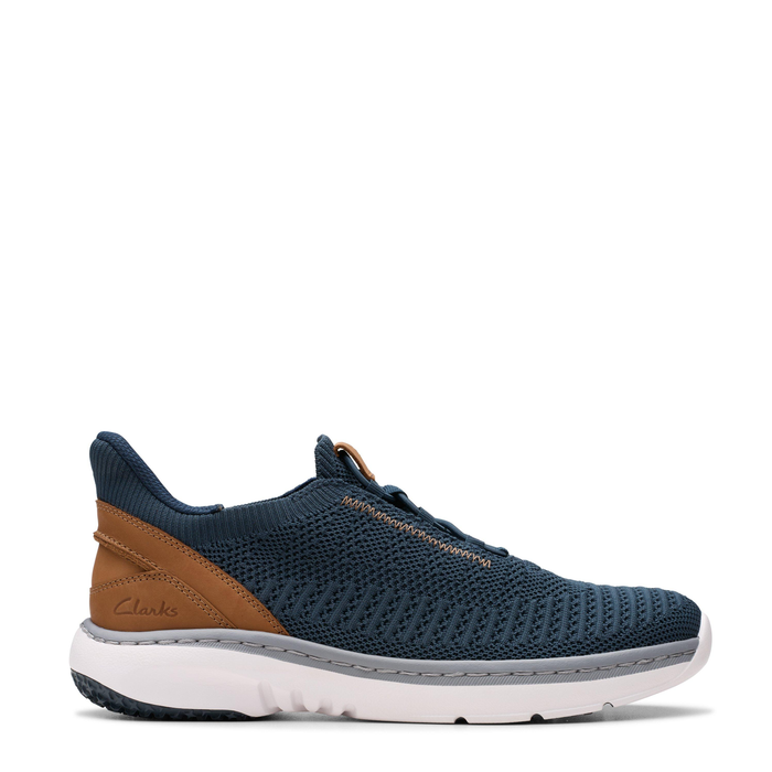 A navy Clarks Pro Lo sneaker with brown accents and a white sole.