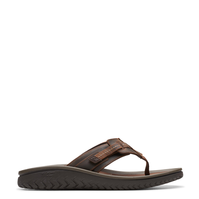 A brown Clarks men's leather flip-flop with a hook and loop closure and a lightweight EVA outsole.
