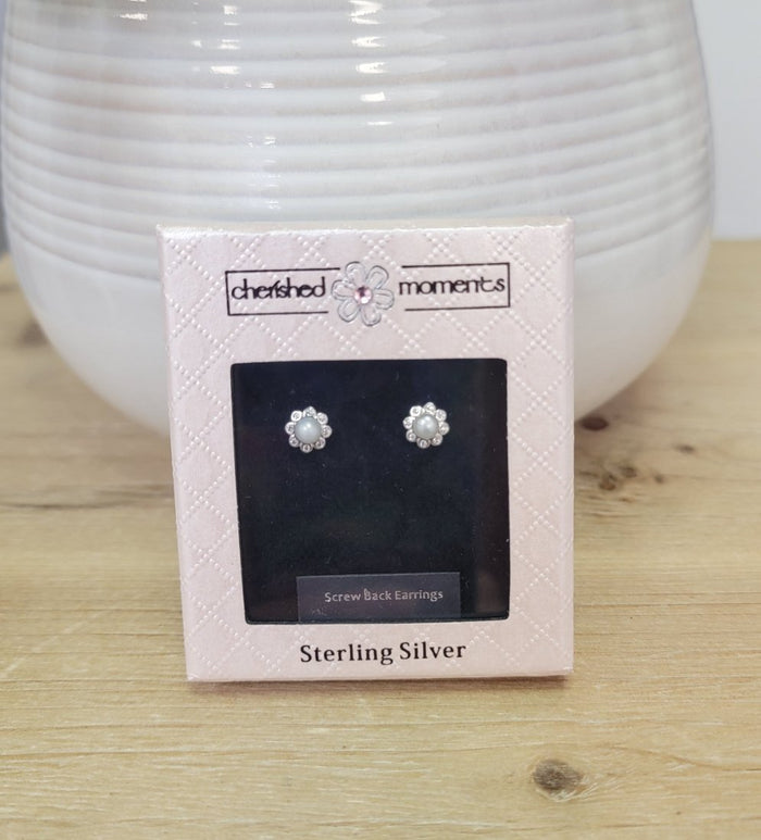 Pearl and jewel flower shaped stud earrings in box.