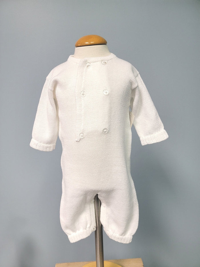 White knit baby boy romper with buttons.