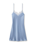 Blue satin slip dress with lace trim on a white background | Lead