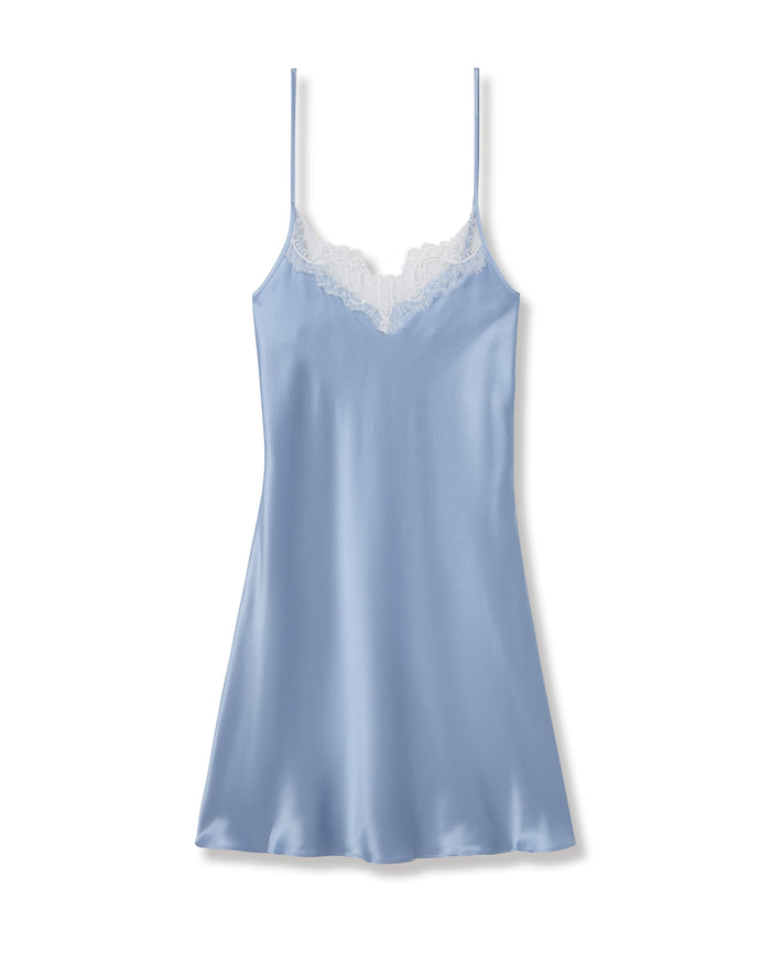Blue satin slip dress with lace trim on a white background | Lead
