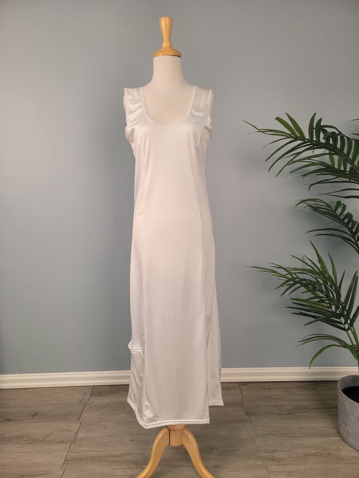 Full length white tank slip with pocket at hem.