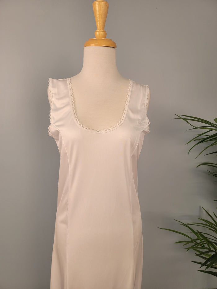 Full length white tank slip.