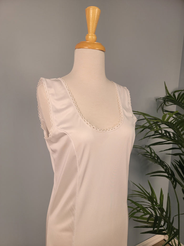 Full length white tank slip.