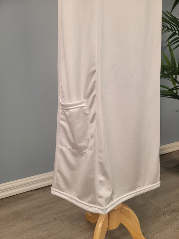 Full length white tank slip with pocket at hem.