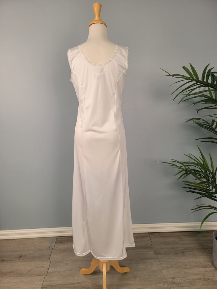 Full length white tank slip with pocket at hem.