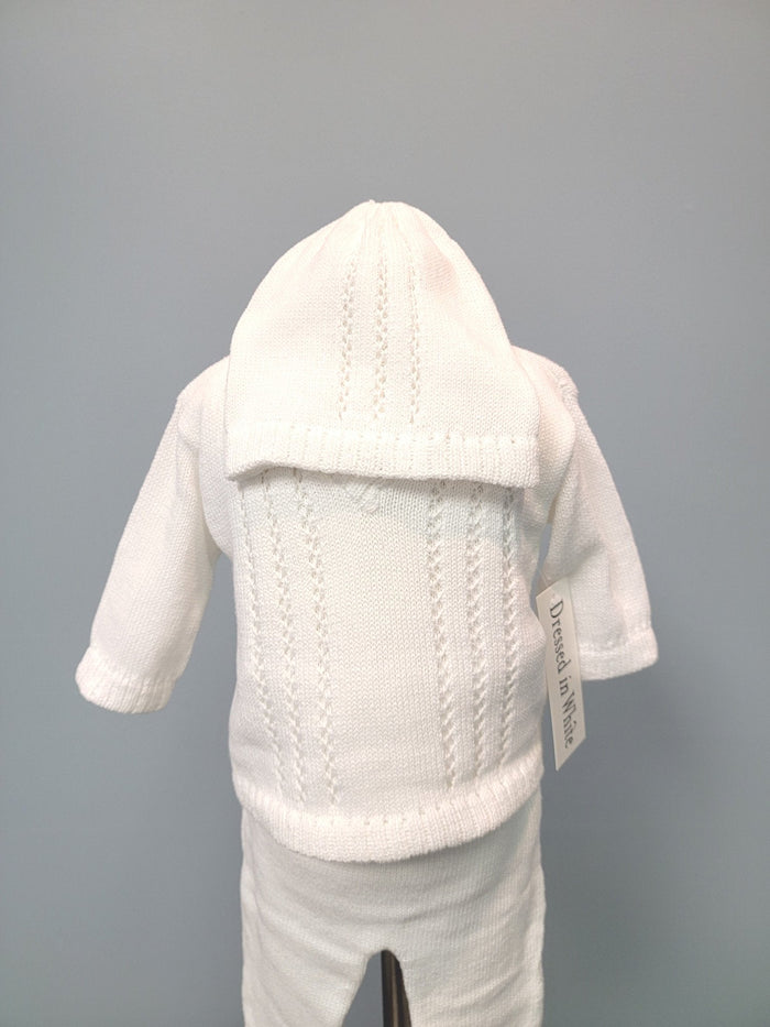 White knit baby boy outfit with bonnet.
