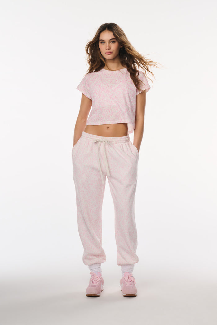 Woman wearing a pink outfit on a white background