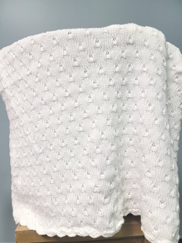 White knit baby blanket.