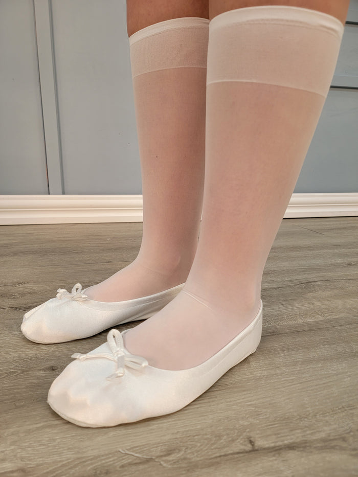 White knee high stockings on model.