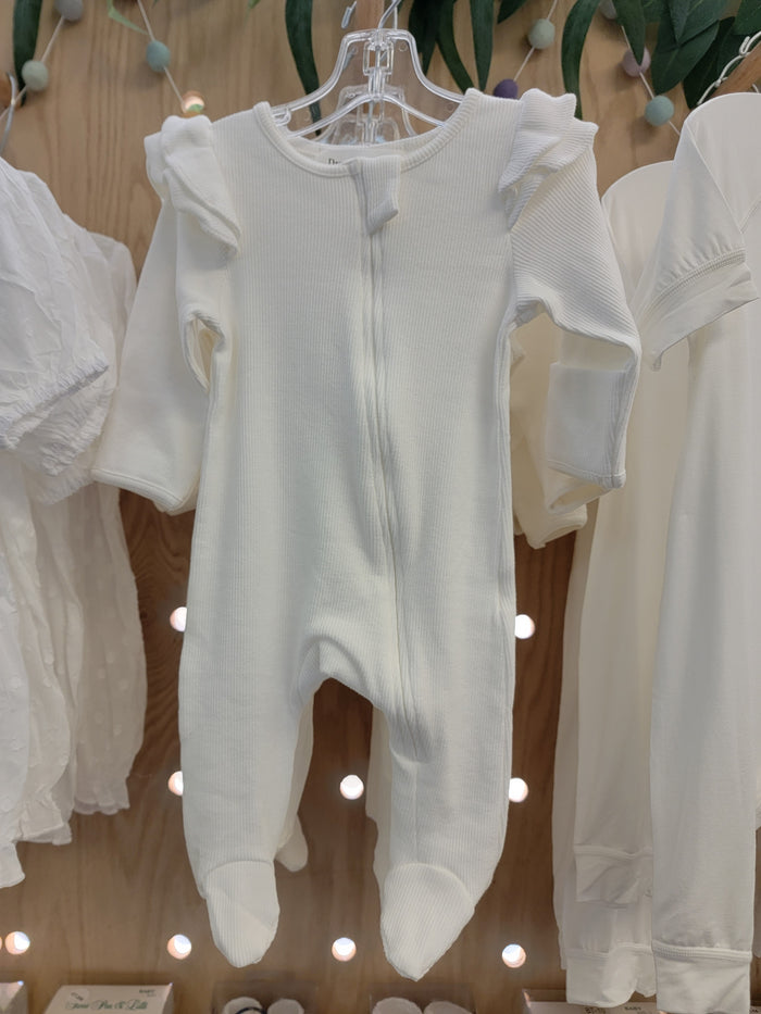 White baby romper with zip front and ruffles.