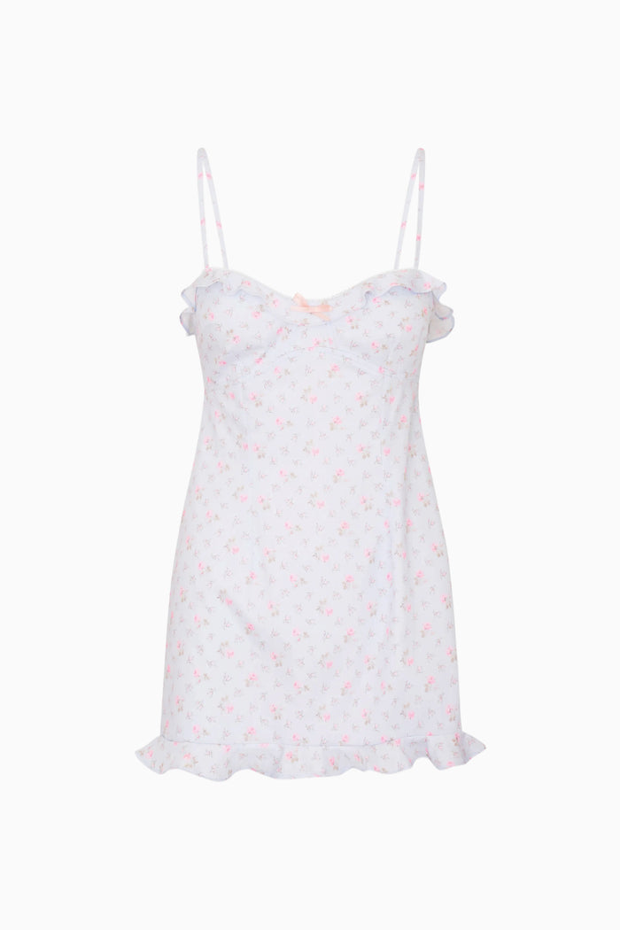 Blue ruffle hem mini dress with thin straps on a white background