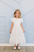 Girl in white eyelet dress