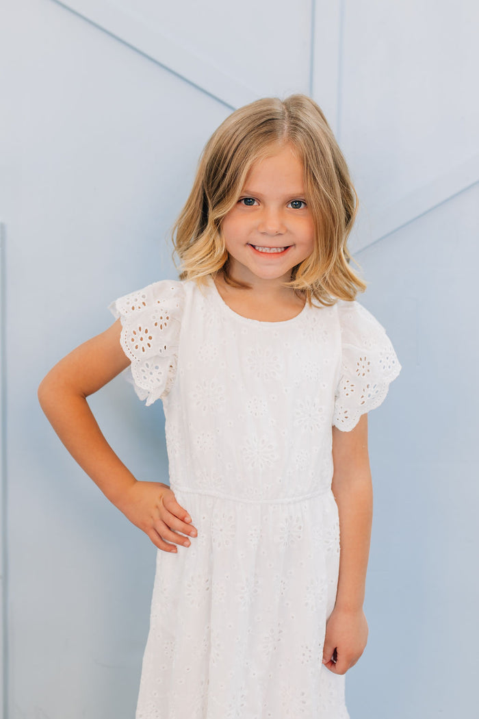 Girl in white eyelet dress