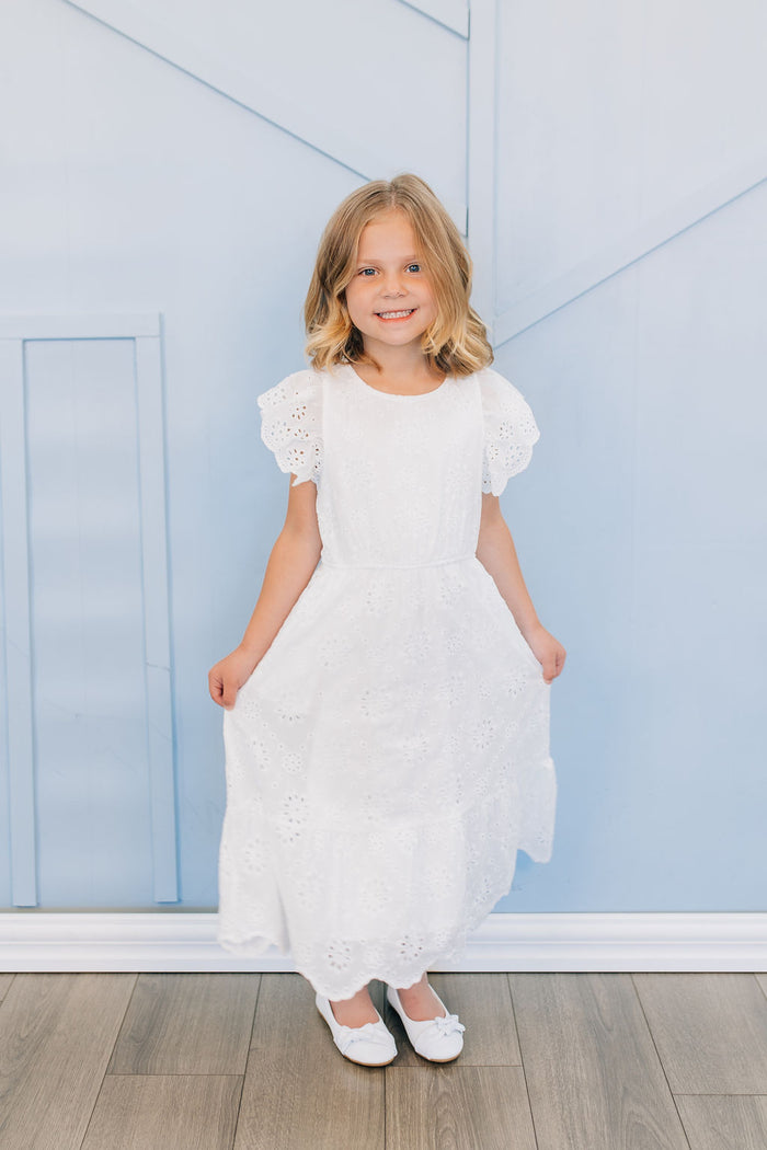 Girl in white eyelet dress