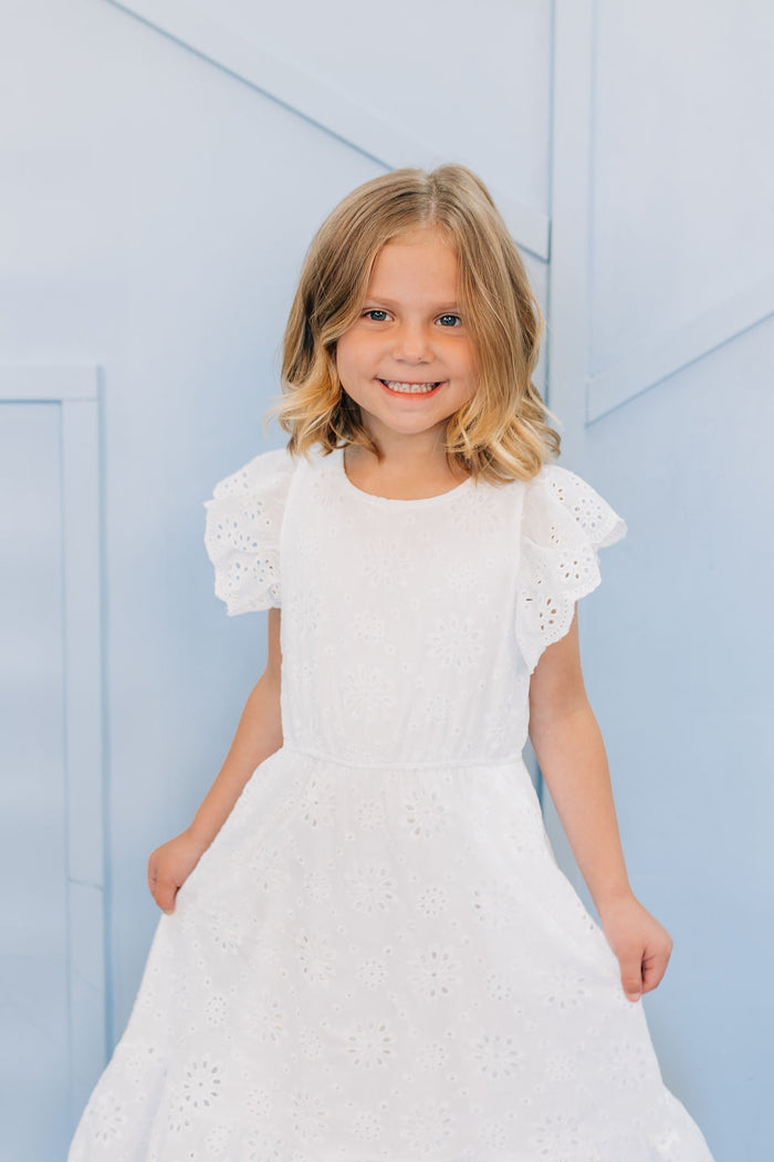 Girl in white eyelet dress