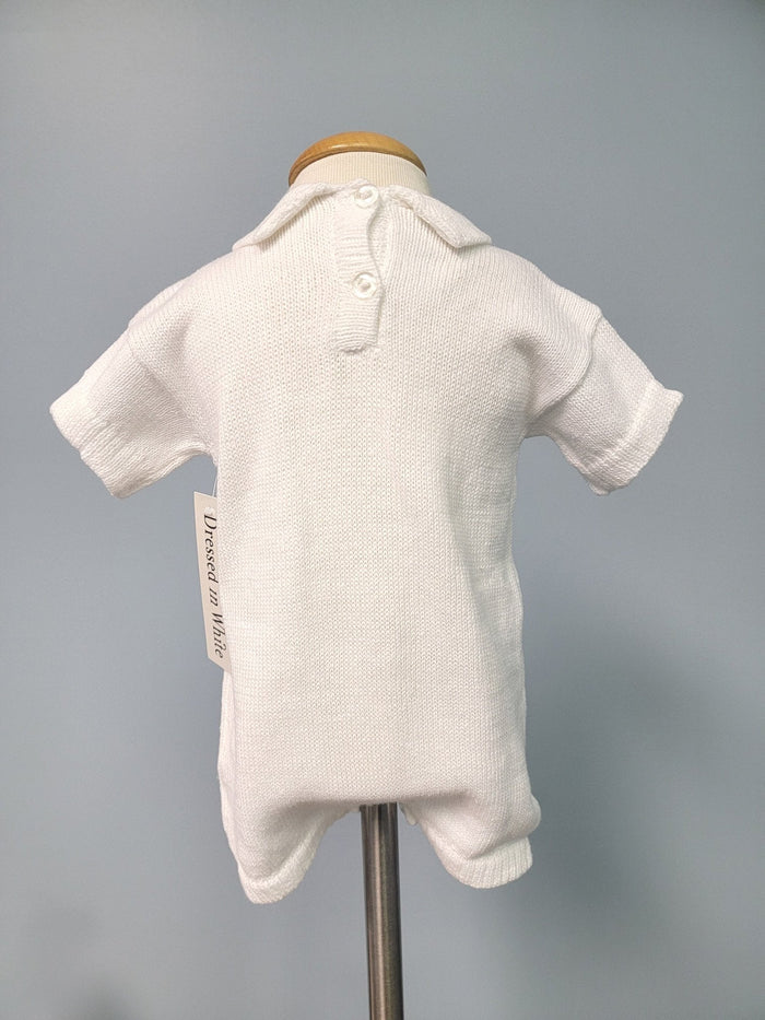 Back of white knit baby romper.