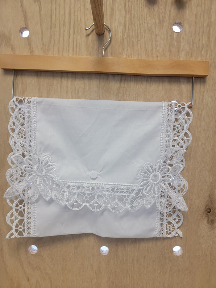White cotton envelope with lace edges.