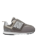 A toddler's New Balance 574 shoe with a grey synthetic/mesh upper and a hook & loop closure system.