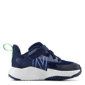 A navy New Balance toddler running shoe with a bungee lace and top strap.