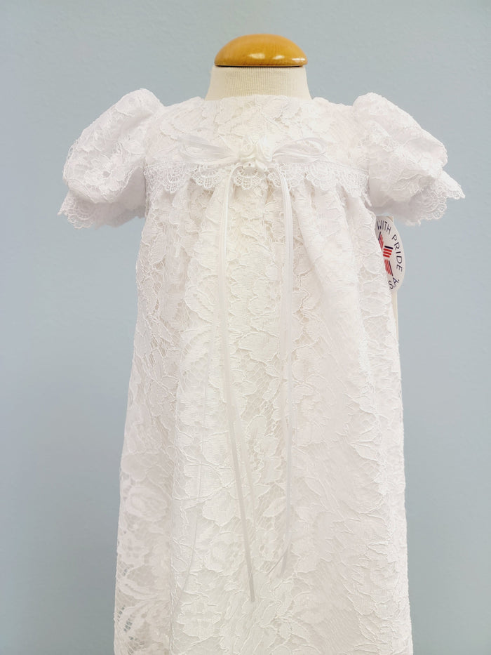 White lace baby gown with bow.