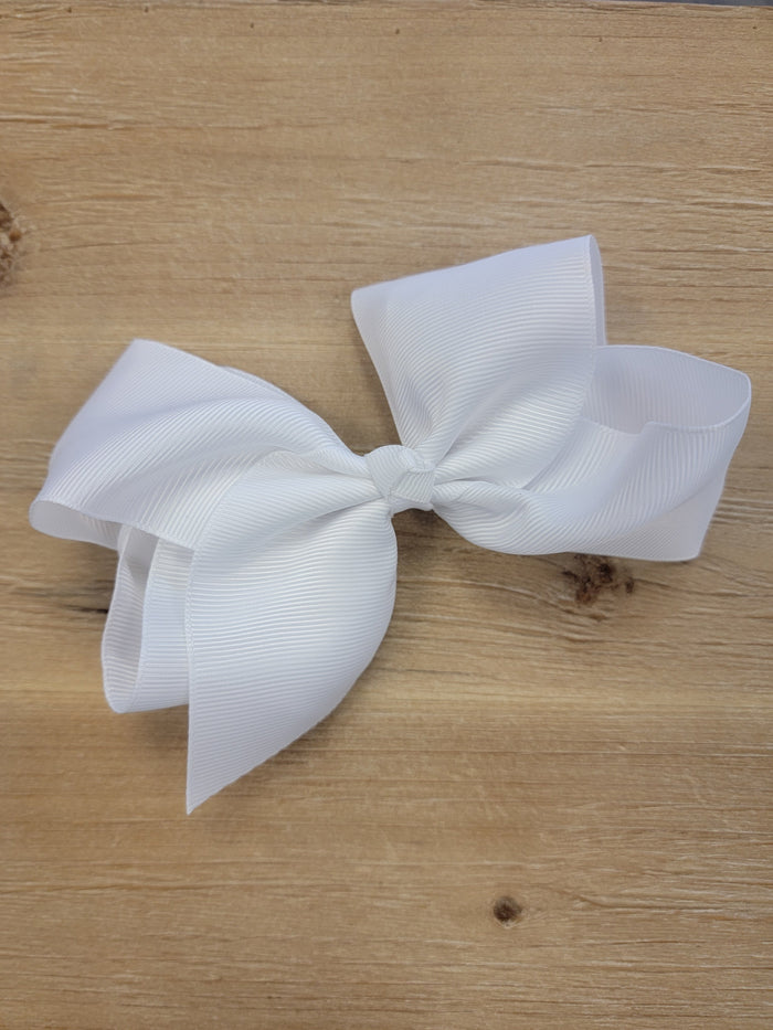 White ribbon bow hair clip.