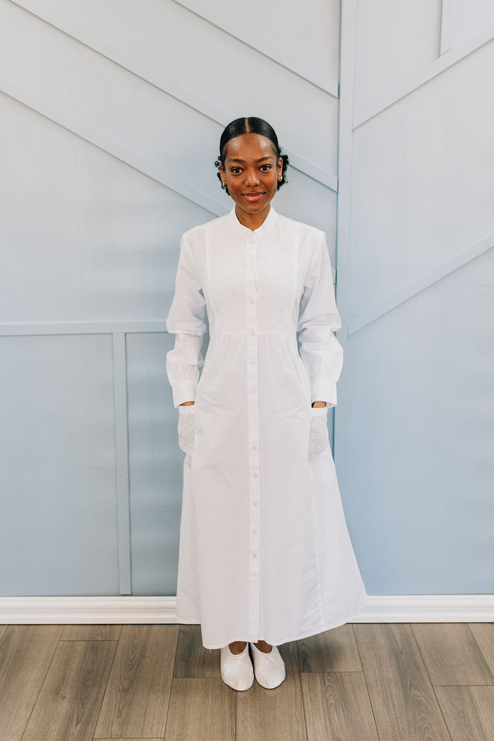 White button front cotton dress with eyelet details.