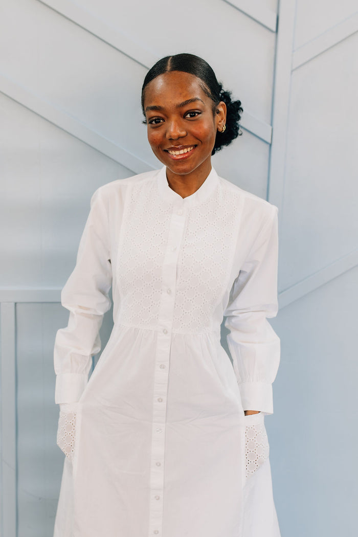 White button front cotton dress with eyelet details.