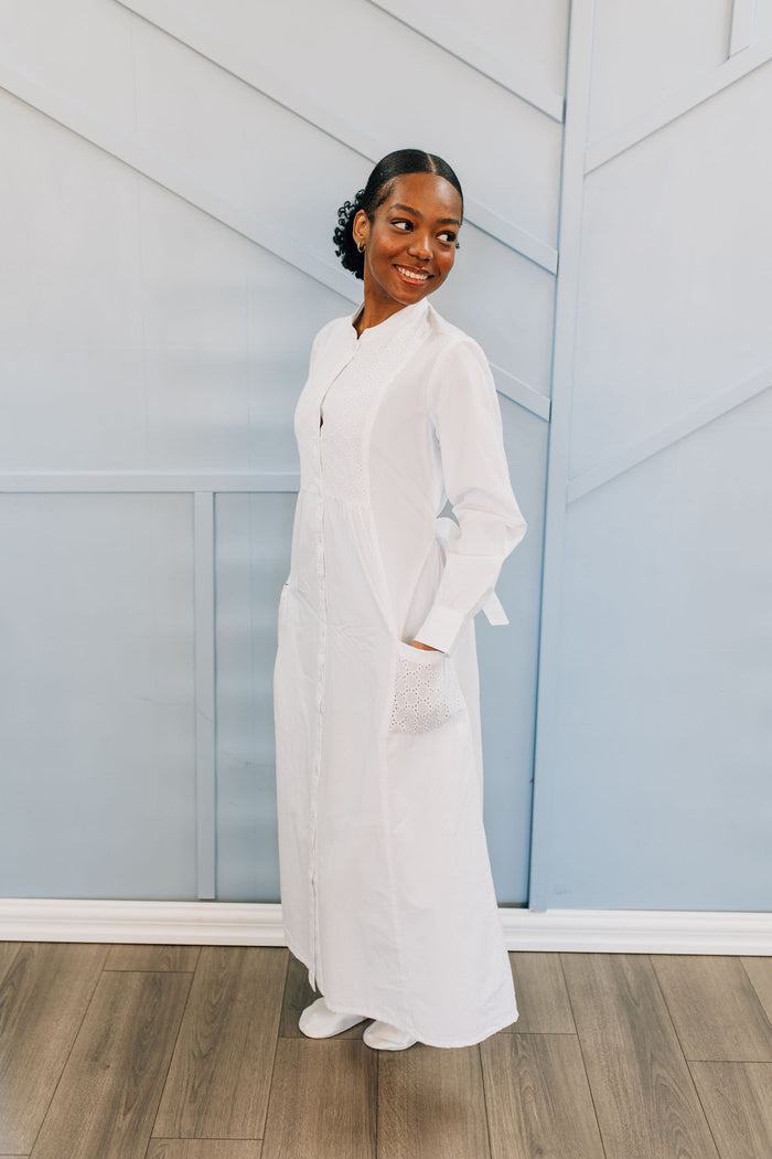 White button front cotton dress with eyelet details.