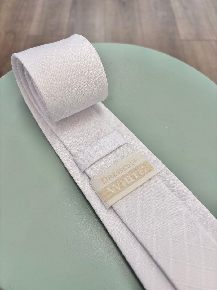 White tie with subtle square pattern and logo on back.