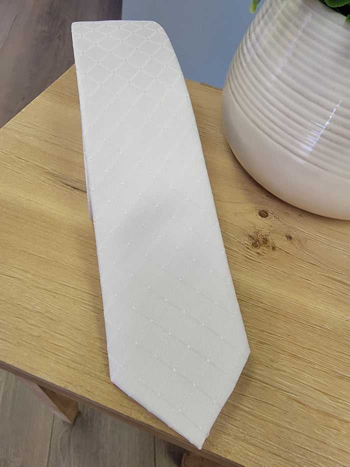 White tie with subtle square pattern.