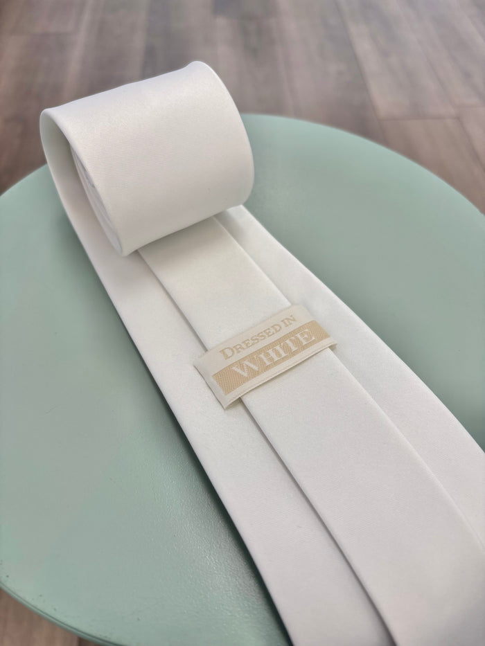 Plain white tie with logo on back.