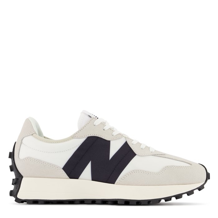 A pair of New Balance women's sneakers with a beige, black, and white color scheme, featuring the brand's 'N' logo.