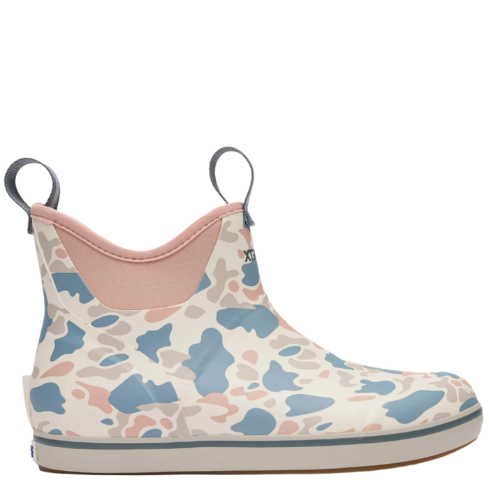 Camo-patterned rain boot with pink interior on a white background