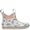 Camo-patterned rain boot with pink interior on a white background