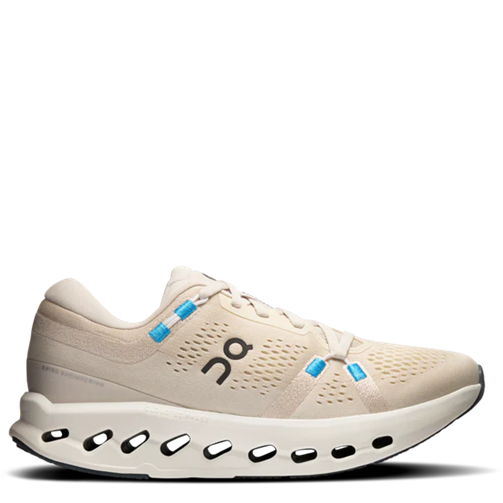 Beige running shoe with blue accents on a white background