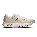 Beige running shoe with blue accents on a white background