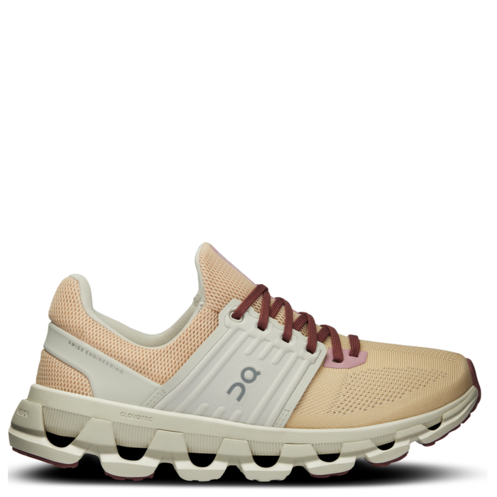 A pair of women's ON Running Cloudswift 3 AD sneakers in beige, white, and pink colors with a mesh upper and a distinctive sole unit.