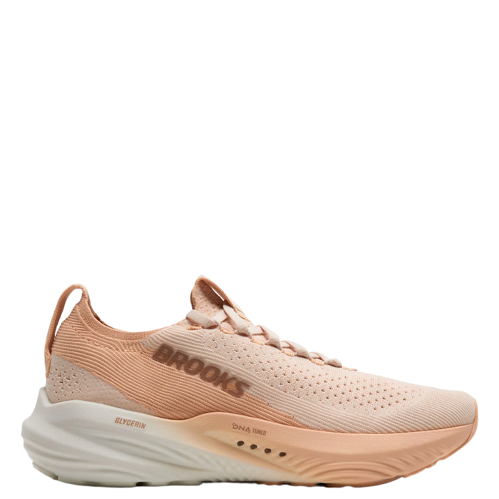 A pair of women's Brooks running shoes in pink color, featuring a mesh upper and a thick cushioned sole.