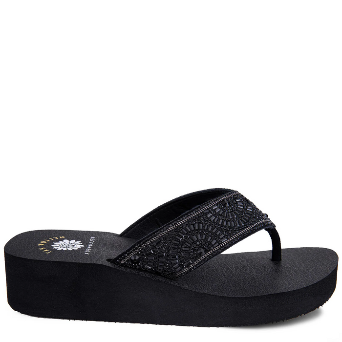 A black women's wedge sandal with a round toe and embellished straps, from the Mellow Mat collection.