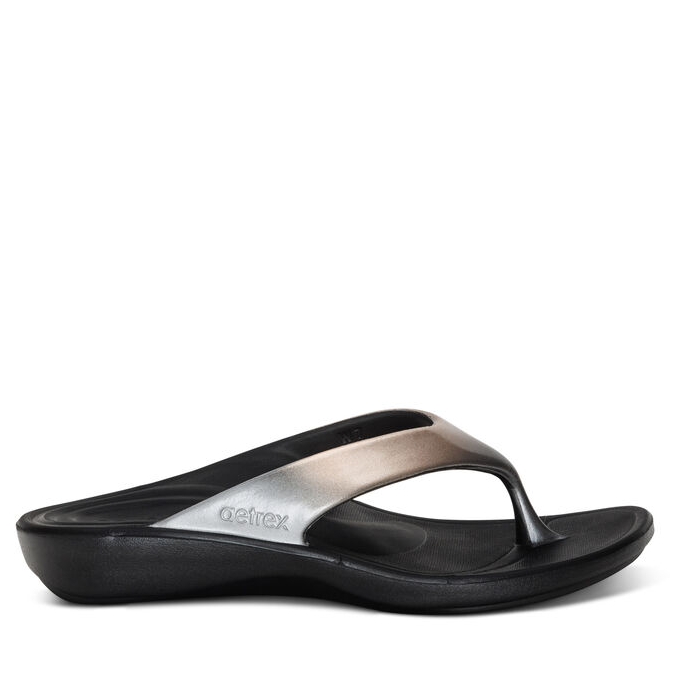 A pair of women's Aetrex Maui orthotic flip-flops made from UltraSky injected EVA, featuring a contoured design for comfort and support.